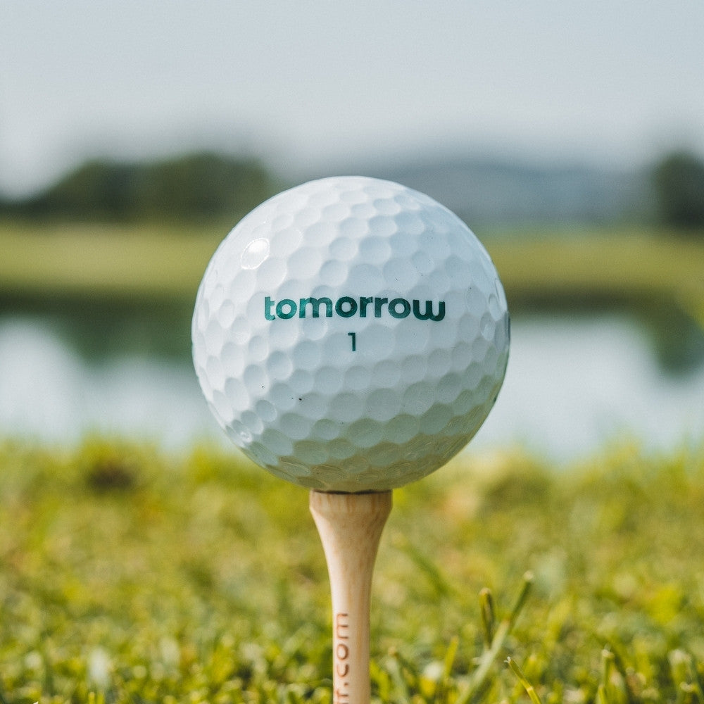 tomorrow golf ball on tee close up